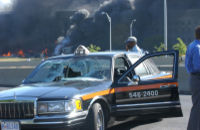 Above, a taxicab was hit by a lightpole as American Airlines Flight 77 passed over Washington Boulevard and crashed into the Pentagon.